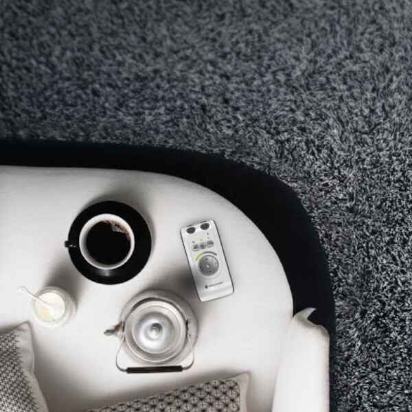 Personal Hearing Amplifier Displayed On Couch